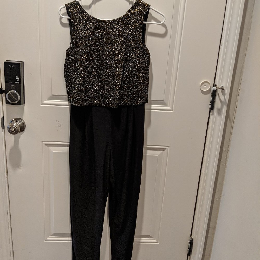 Black and gold jumpsuit ready for a party